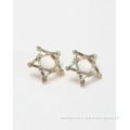 Star shaped stud earrings with diamond and gold plated